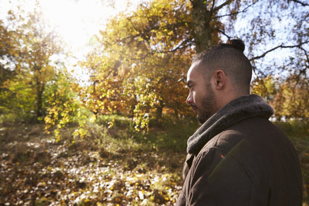 Man walking alone in a woodland. 